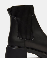 HUTCHH20 Black Water-Resistant Lug Sole Ankle Boot | Women's Booties | Steve Madden on Sale