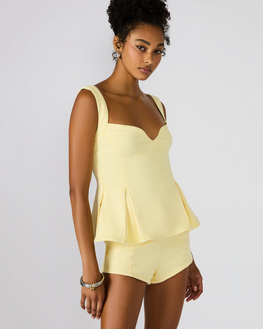 ZENIA Golden Glow Sleeveless Peplum Women's Top | Steve Madden for Sale